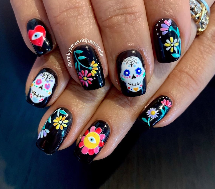 Day of the Dead and Halloween are literally next door neighbors on the calendar and @emilygilmour.nails shows off a dual purpose set on IG