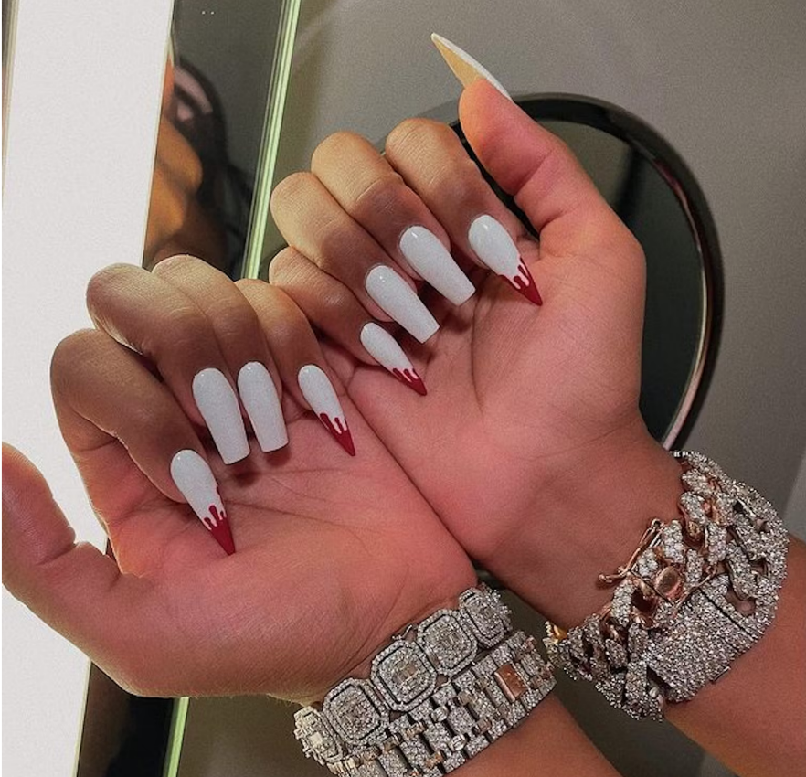 Megan Thee Stallion has always been known for her strong nail game and in 2021, she dolled up her nails to look like fangs